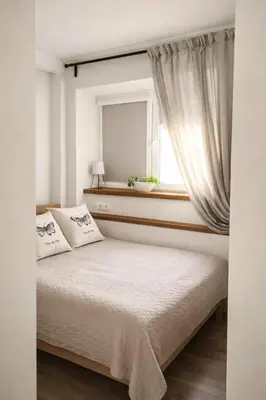 a bedroom with a bed and a window at The Central Spot in Šiauliai