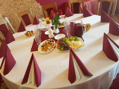 a long table with plates of food on it at Pasienis in Pasvaliečiai