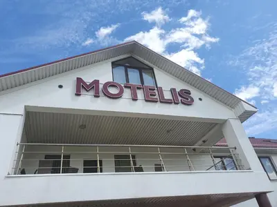 a métis sign on top of a building at Pasienis in Pasvaliečiai