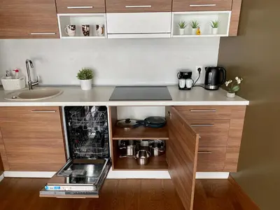 a kitchen with a sink and a counter top at Chocolate Apart in Druskininkai