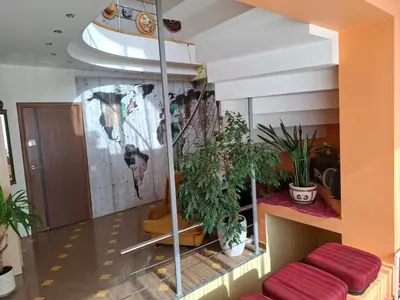 a room with plants on the wall and a staircase at A&L private rooms in Kaunas in Kaunas