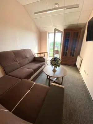 a living room with a couch and a table at Rezidencija 