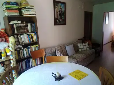 a living room with a table and a couch at Česlovos sodyba in Zarasai