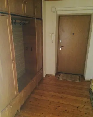 an empty room with a closet and a door at Jolando Apartment in Kaunas