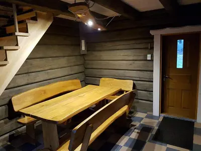 a wooden table in the corner of a room at Escape of city in Pabiržė