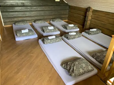 a group of four beds in a room at Escape of city in Pabiržė