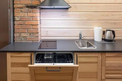 a kitchen with a sink and a counter top at Vila Rica in Ricieliai