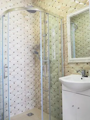 a bathroom with a shower and a sink at Emi apartment in Vilnius