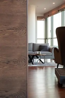 a living room with a couch and a table at Luxury Panoramic Vilnius apartment in Vilnius
