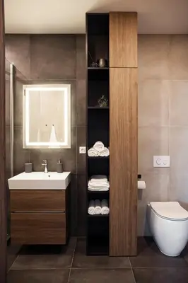 a bathroom with a sink and a toilet at Luxury Panoramic Vilnius apartment in Vilnius