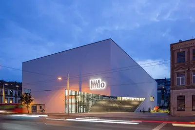 a building with a sign on the side of it at Luxury Panoramic Vilnius apartment in Vilnius