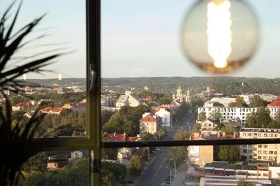 a view of a city from a window at Luxury Panoramic Vilnius apartment in Vilnius