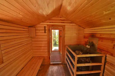 an inside view of a room in a wooden cabin at Camping Mindunai in Mindūnai
