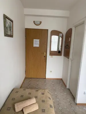 a room with a door and two towels on the floor at Turnė Guest House in Šiauliai