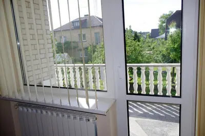 a balcony with a view of a building at Turnė Guest House in Šiauliai