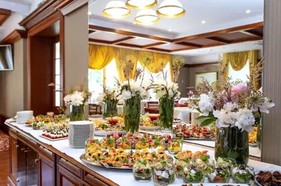a buffet line with many plates of food at Hotel Violeta in Druskininkai
