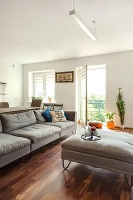a living room with a couch and a table at #inVilnius - Spacious & Bright 1BDR Apartment Shopping District in Vilnius