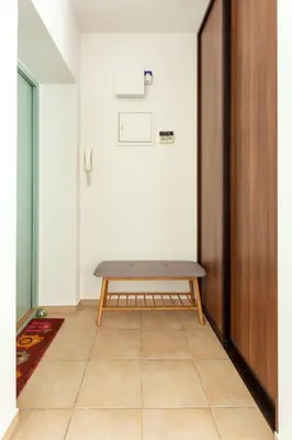 a room with a bench on the wall at #inVilnius - Spacious & Bright 1BDR Apartment Shopping District in Vilnius