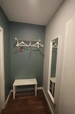 a dressing room with a bench and a mirror at Stay Vilnius Hotel in Vilnius