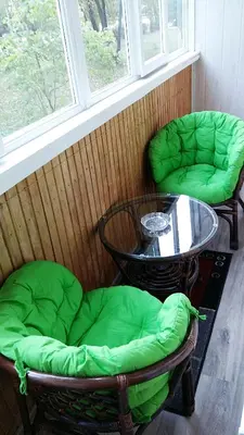 a room with two chairs and a table and a window at Apartments Victoria in Panevėžys