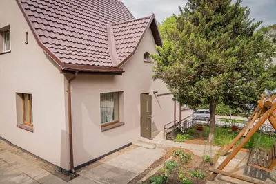 an image of a house with a roof at Cozy Stay Apartment in Kaunas