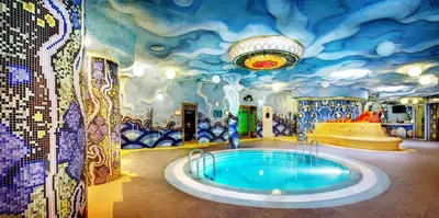 a room with a hot tub in the middle at Grand SPA Lietuva Serviced Apartments Dzūkija in Druskininkai