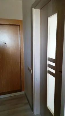 an empty room with a door and a hallway at Apartamentai Centras in Šiauliai