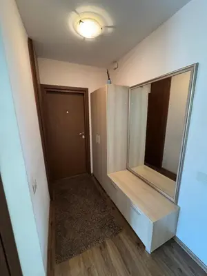 an empty room with a mirror and a closet at Apartamentai Dainų in Šiauliai