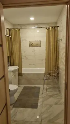 a bathroom with a shower and a toilet and a sink at Garden Studio by the Lake with Air-Con and Infrasauna in Druskininkai
