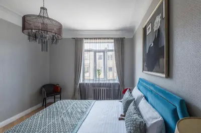 a bedroom with a bed and a window at Avenue in Šiauliai