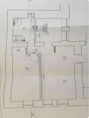a drawing of a floor plan of a building at Luxury old town apartment in Vilnius