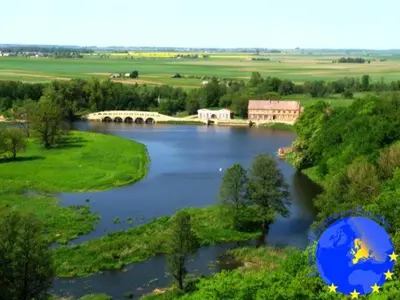 an aerial view of a river with a bridge at Pakruojis Manor Hotel Miller's house in Pakruojis
