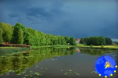 a river with a blue ball in the water at Pakruojis Manor Hotel Miller's house in Pakruojis