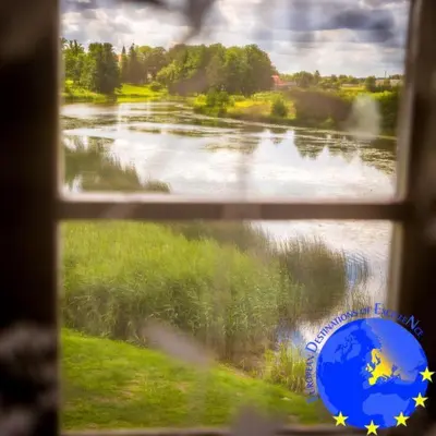 a view of a river from a window at Pakruojis Manor Hotel Miller's house in Pakruojis