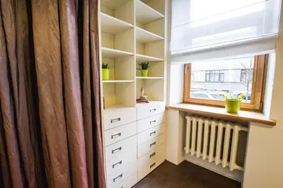 a closet with a window and a radiator in it at MOCHA HOUSE 3 ROOM CENTRAL APARTMENT 56d in Kaunas