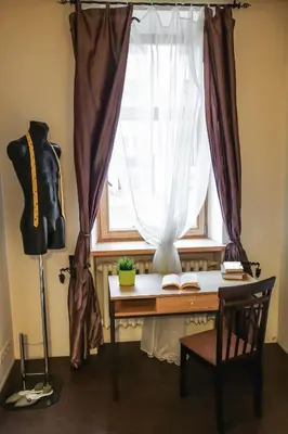 a window with a desk in front of a window with a window at MOCHA HOUSE 3 ROOM CENTRAL APARTMENT 56d in Kaunas