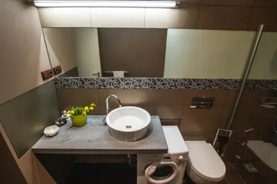a bathroom with a sink and a toilet and a mirror at MOCHA HOUSE 3 ROOM CENTRAL APARTMENT 56d in Kaunas