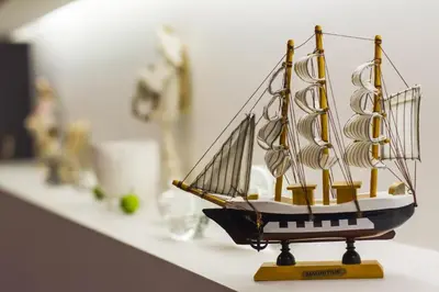 a small model of a boat sitting on a counter at MOCHA HOUSE 3 ROOM CENTRAL APARTMENT 56d in Kaunas