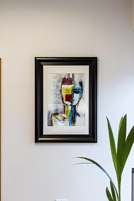 a painting of a wine glass hanging on a wall at Modern 1BD Apartment in Old Town by Hostlovers in Kaunas