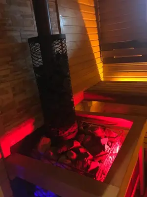 a sauna with red and blue lights in it at Holiday House & Sauna in Druskininkai in Neravai