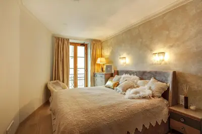 a bedroom with a large bed with pillows on it at Luxury, comfort & quiet place next to Cathedral in Vilnius