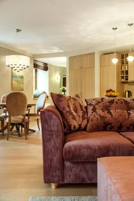 a living room with a couch and a dining room at Luxury, comfort & quiet place next to Cathedral in Vilnius