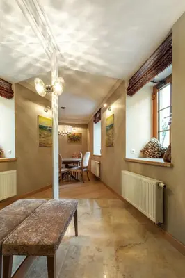 a living room with a table and a ceiling at Luxury, comfort & quiet place next to Cathedral in Vilnius