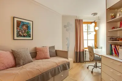 a living room with a couch and a desk at Luxury, comfort & quiet place next to Cathedral in Vilnius