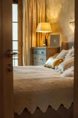 a bedroom with a bed and a laptop on a desk at Luxury, comfort & quiet place next to Cathedral in Vilnius