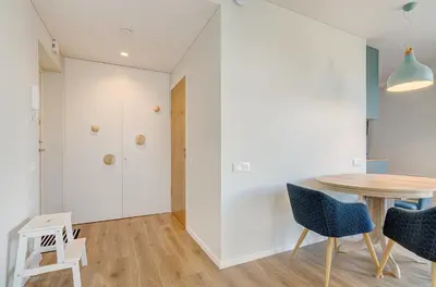 a dining room with a table and chairs at City View Apartment 57 in Vilnius