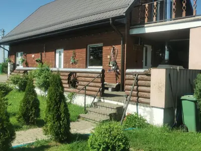 a house with stairs in front of it at Edmart in Dobromislė