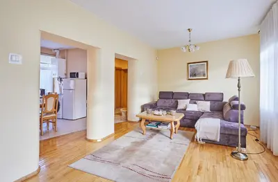 a living room with a couch and a table at Kurpių gatvė in Kaunas