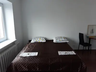 a bed with two pillows on it in a room at Tilžės gatvė 144 in Šiauliai