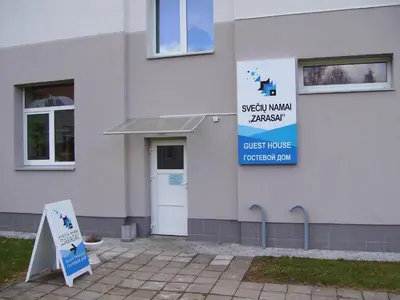 a building with a sign for a guest house at Apgyvendinimo įstaiga KORNEALITA-ZARASAI in Zarasai